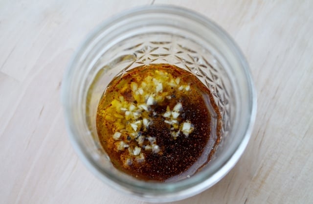 olive oil, garlic and seasonings in a glass mason jar