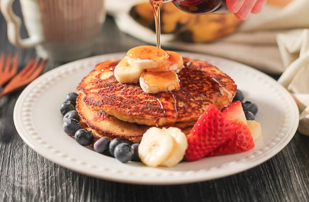 These Banana Coconut Flour Pancakes are the perfect option for your weekend breakfast. This gluten free and dairy free recipe is super filling and tastes lovely with fresh fruit and maple syrup. #healthy #glutenfree #pancakes