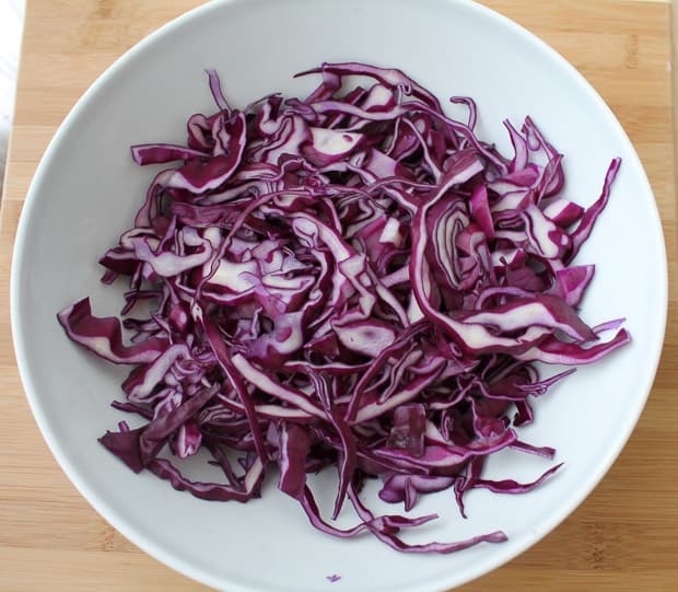 shredded red cabbage in a large mixing bowl