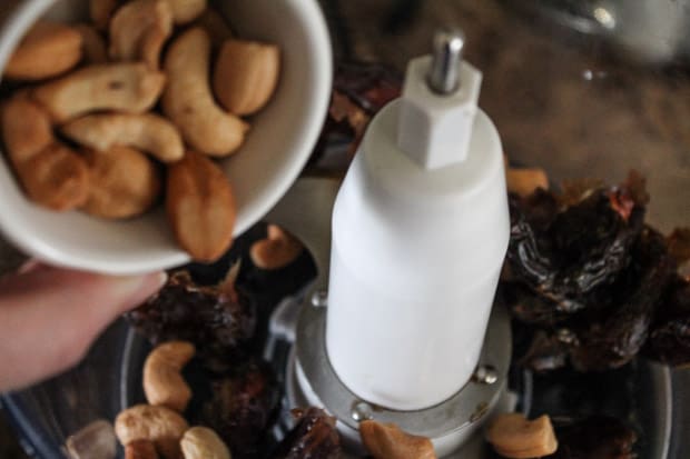 Dates and cashews in a food processor.