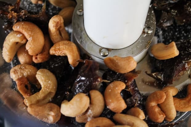 Dates and cashews in a food processor.