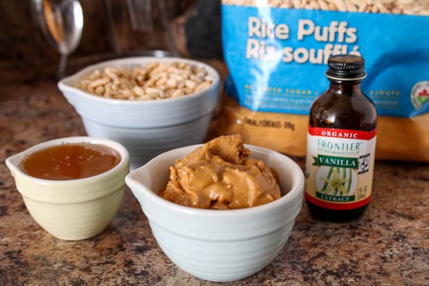 Measuring cups with ingredients for healthy balls.