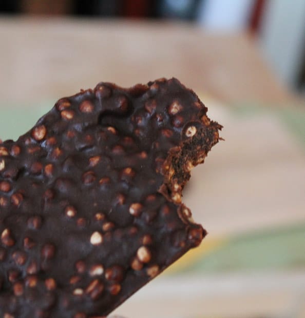 healthy chocolate crunch bar with a big bite out of it