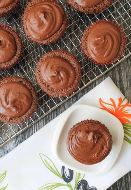 These Fudgy Olive Oil Cupcakes are gluten free AND dairy free yet are FULL of rich, chocolaty flavor. Whip up a batch of these and watch them all disappear. #glutenfree #recipe #cupcakes
