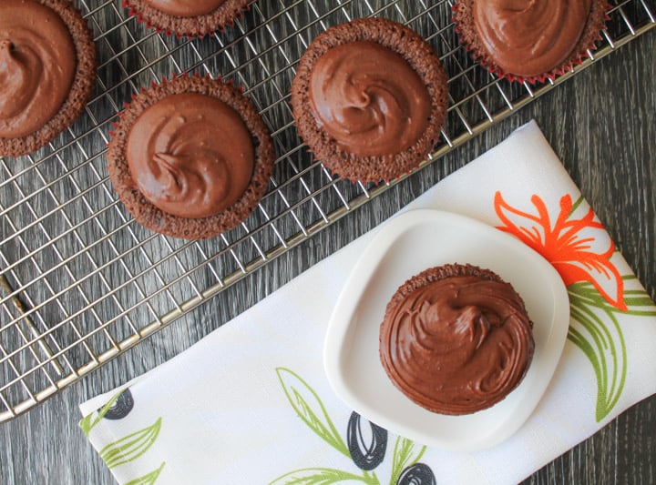 These Fudgy Olive Oil Cupcakes are gluten free AND dairy free yet are FULL of rich, chocolaty flavor. Whip up a batch of these and watch them all disappear. #glutenfree #recipe #cupcakes