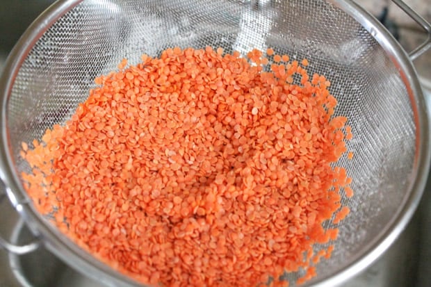 Red lentils in a strainer