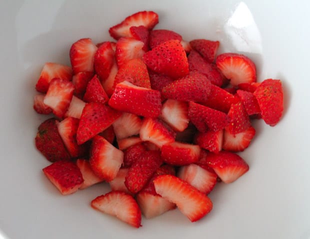 A bowl of chopped berries.