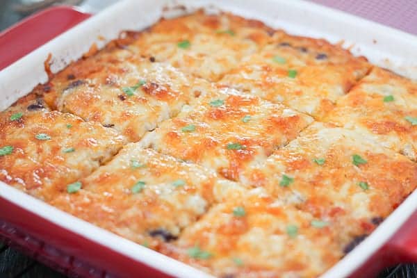 Cheesy casserole in a baking dish, hot and bubbling from the oven.