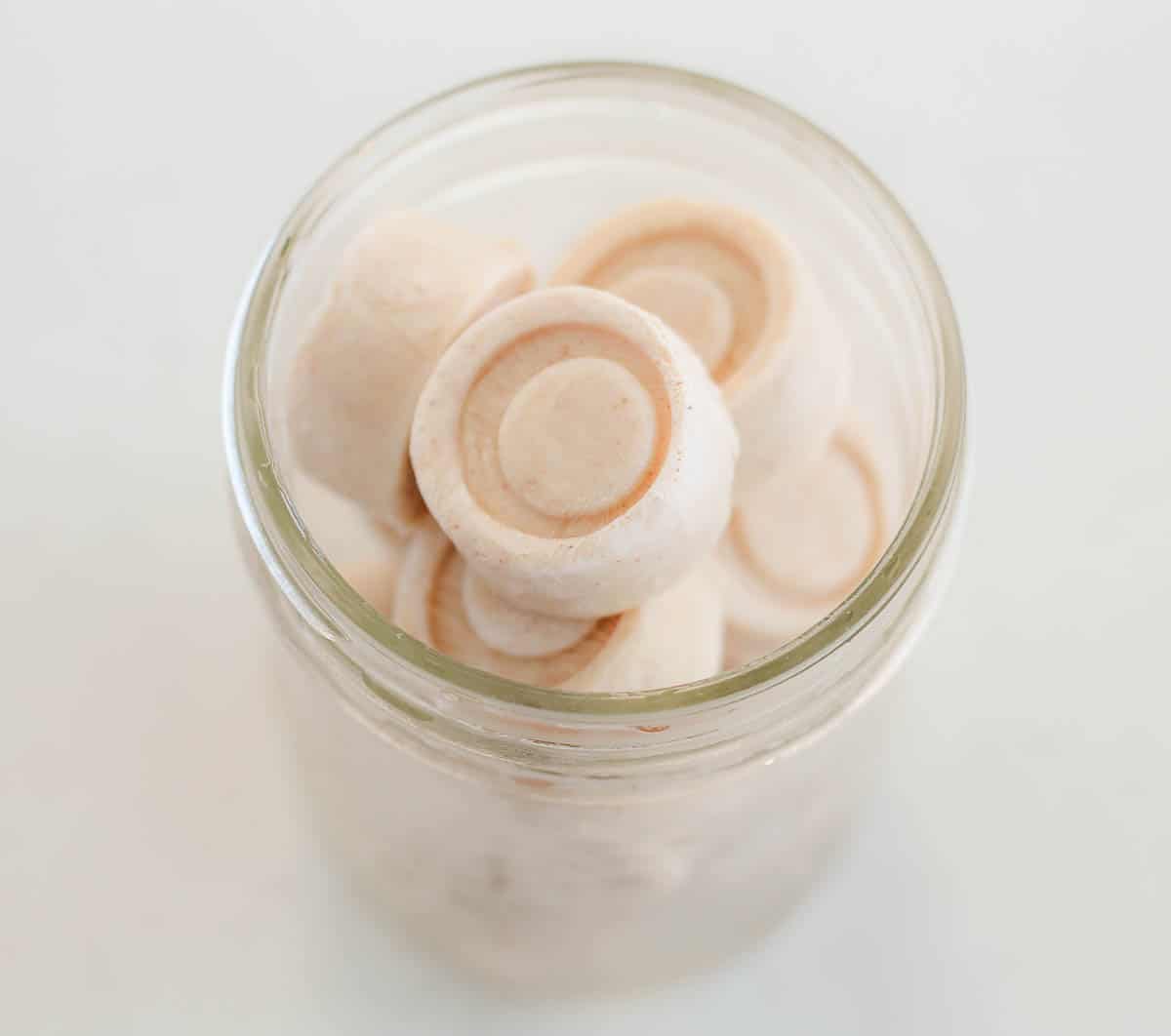 frozen yogurt bites in a frosty glass jar