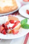 gluten free strawberry shortcake on a plate garnished with mint