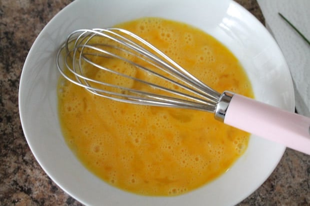Eggs being beaten with a whisk