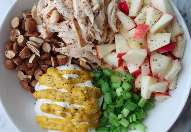 Chicken salad ingredients in a white bowl