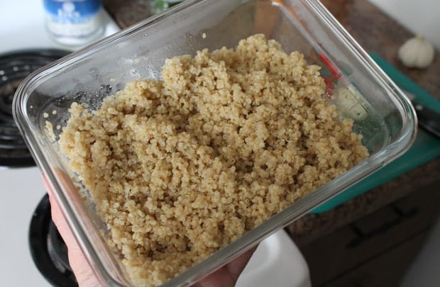 Cooked quinoa in a glass container