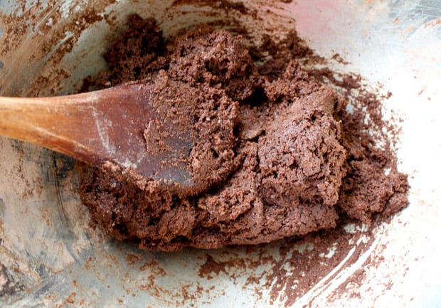 Cookie dough being stirred with a wooden spoon