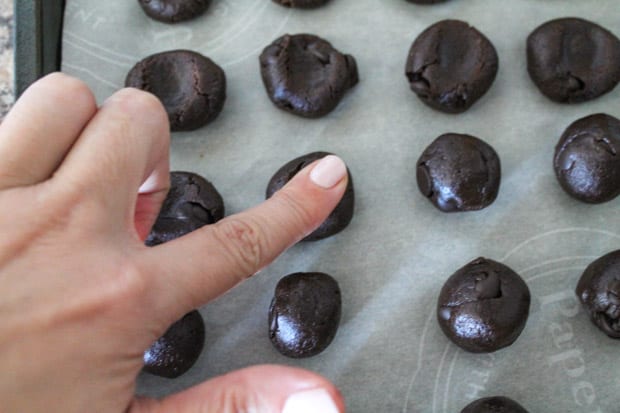 Vegan Banana Brownie Cookie batter being pressed down by a finger