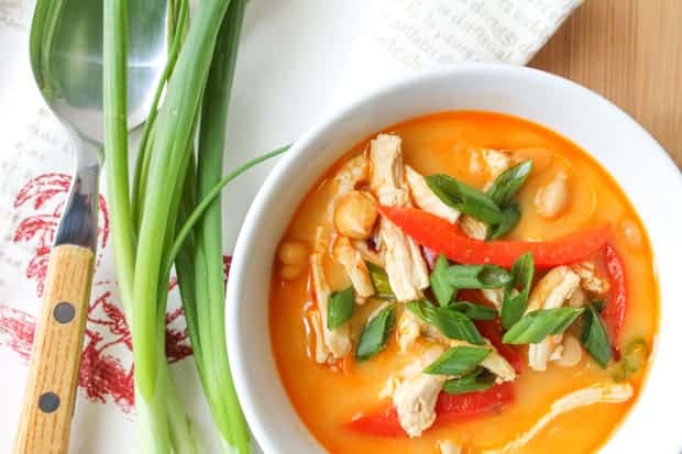Soup garnished with crisp peppers and green onions