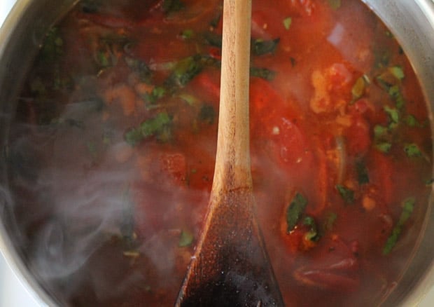 Roasted Tomato Basil Soup simmering in a pot