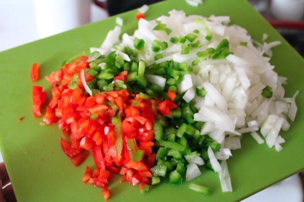 diced peppers and onions on a cutting board