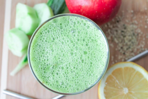 a green smoothie in a large glass