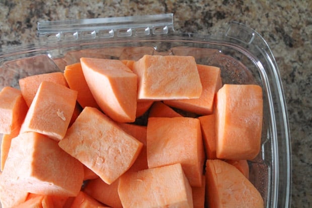 Chopped sweet potato in a plastic container