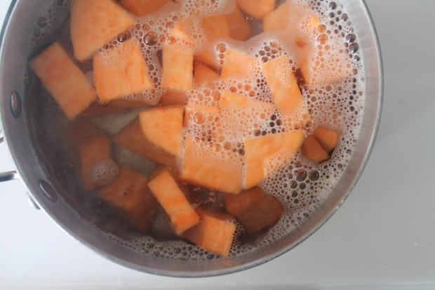 Sweet potatoes boiling in a pot