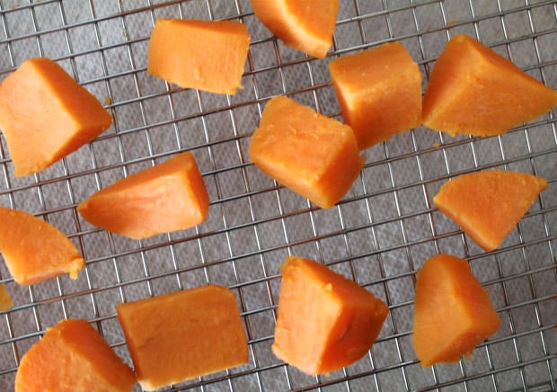 Chunks of sweet potatoes on a wire rack