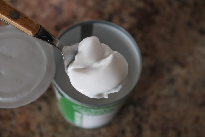 a spoon with coconut cream on it
