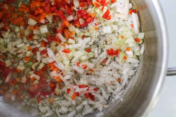 diced vegetables in a soup pot