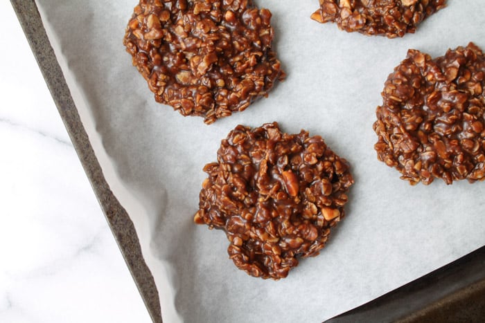 No Bake Chocolate Coconut Oil Cookies chilling on a baking tray