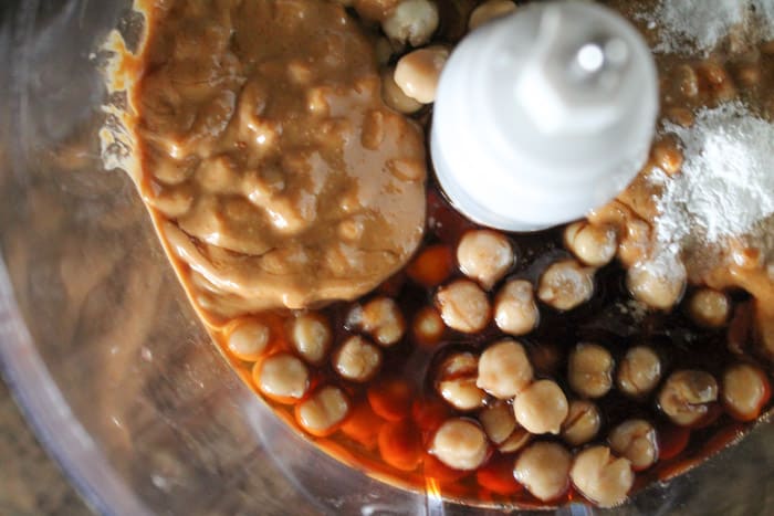 chickpeas and other ingredients in a food processor