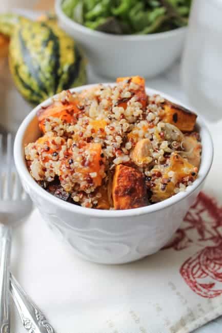 This Spicy Roasted Butternut Squash with Chicken and Quinoa is a tasty gluten free meal with some kick! The squash is roasted with garlic and shallots and makes this dish so delicious.