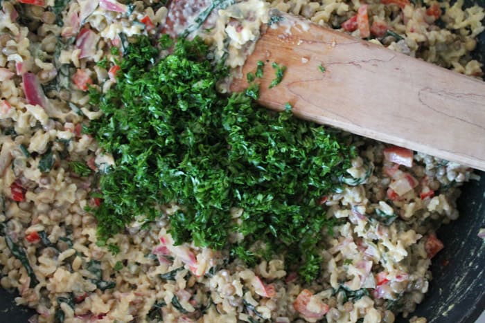 freshly chopped parsley being stirred in.