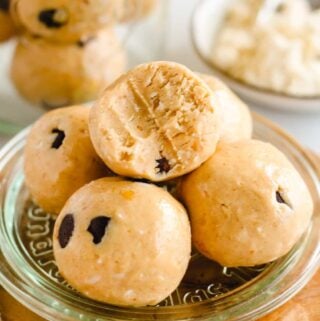 a plate of chocolate chip cookie dough protein balls