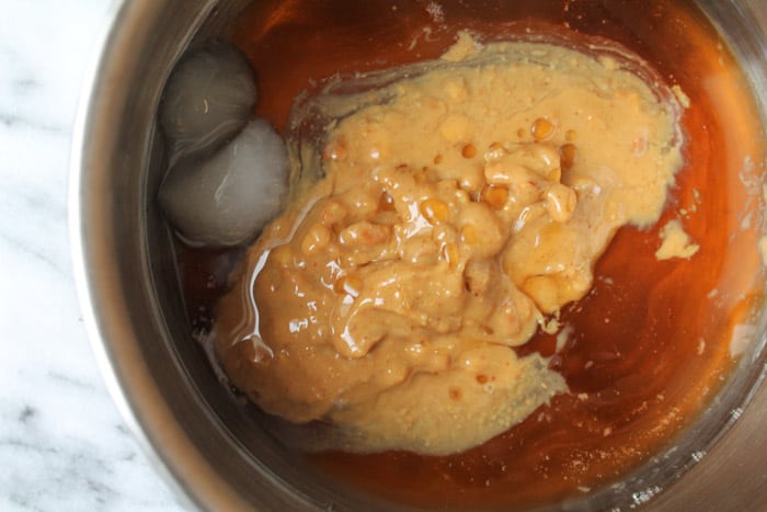 liquid ingredients for healthy energy bites in a small saucepan