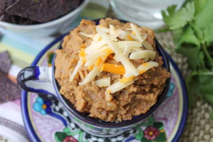 a colourful Mexican mug with homemade refried beans 