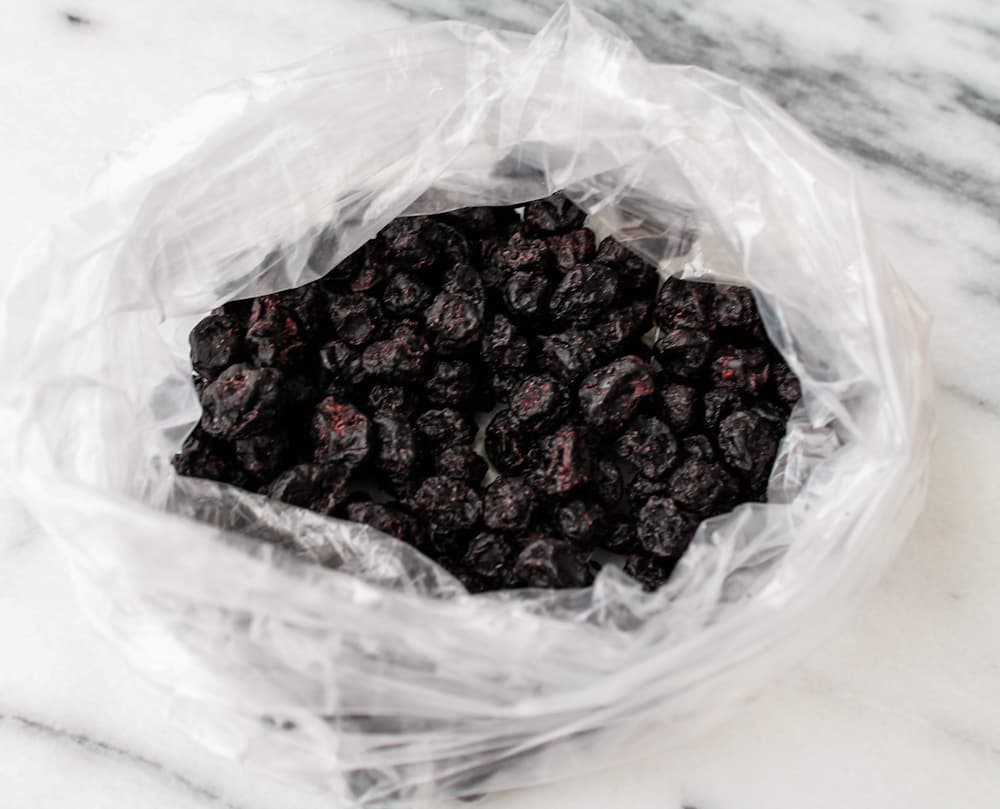 a plastic bag of dried blueberries.