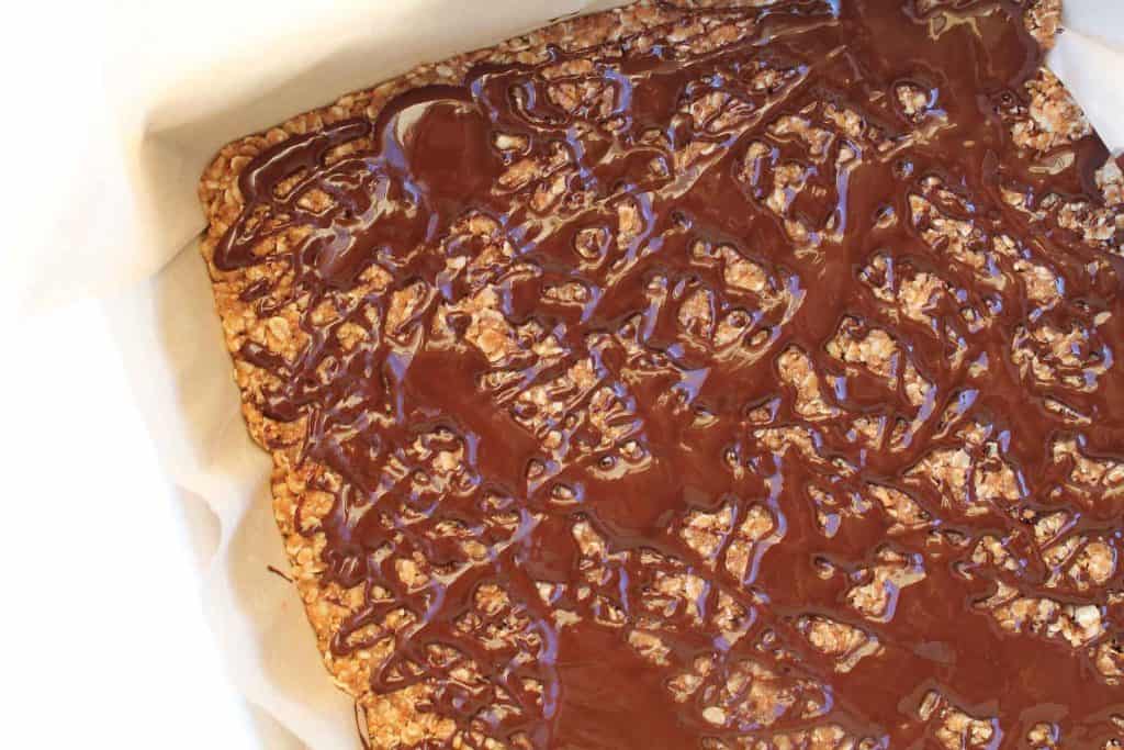 Healthy Butterfinger Bar base drizzled with melted chocolate