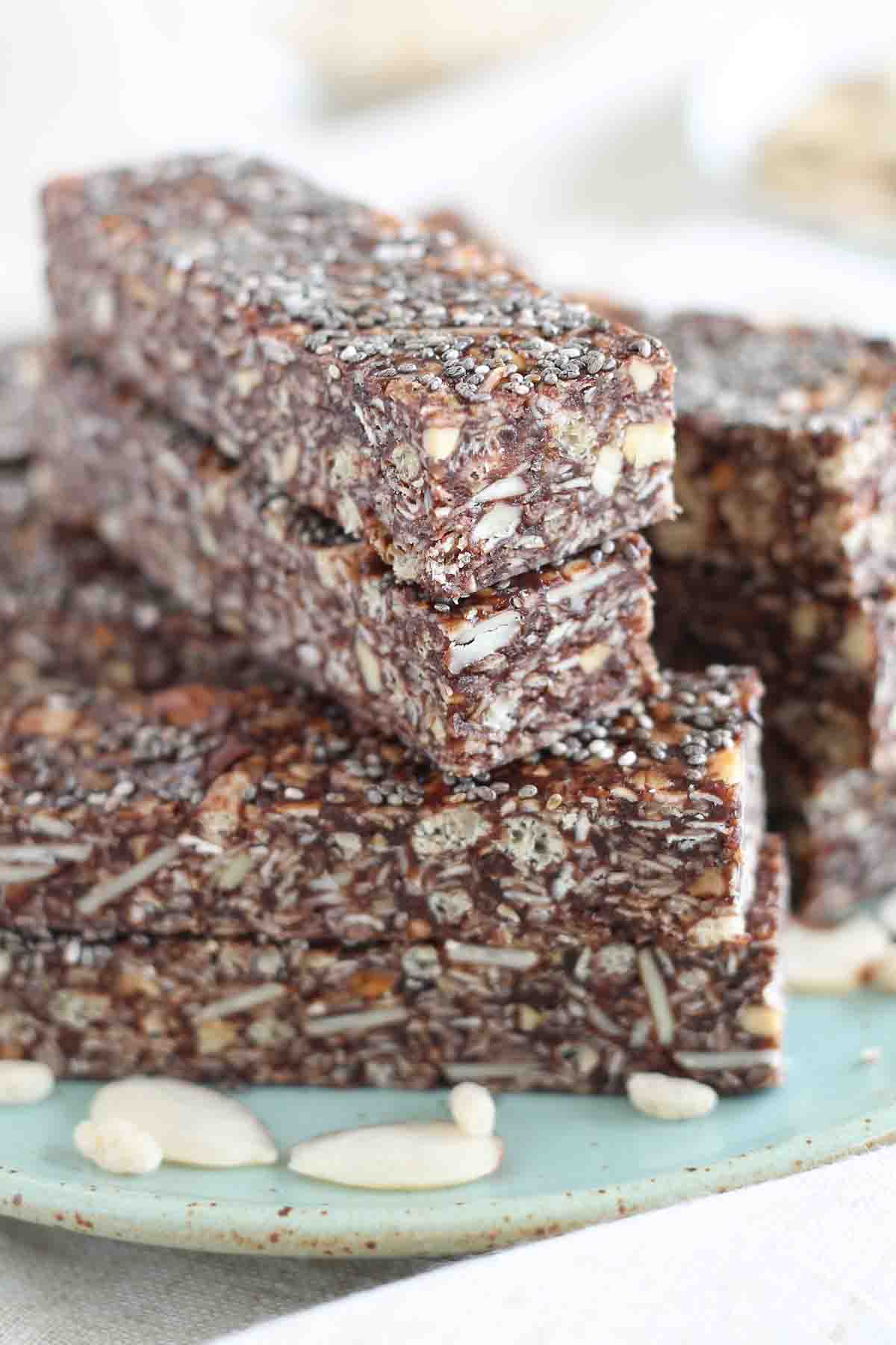 healthy chewy granola bars stacked up on a plate