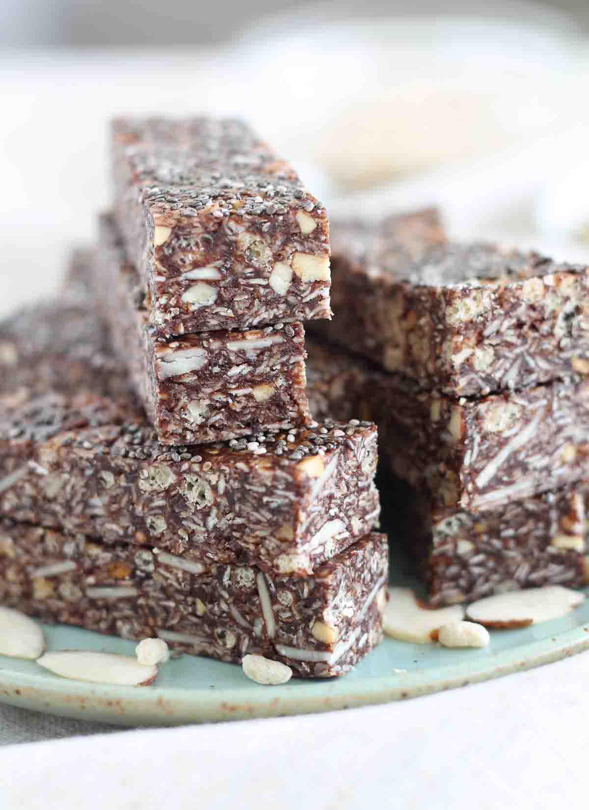 healthy chewy granola bars stacked up on a plate