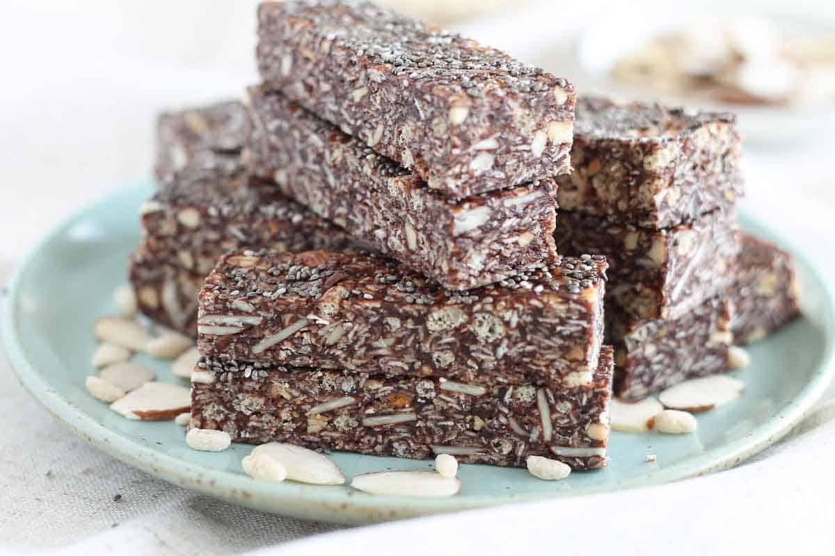 healthy chewy granola bars stacked up on a plate