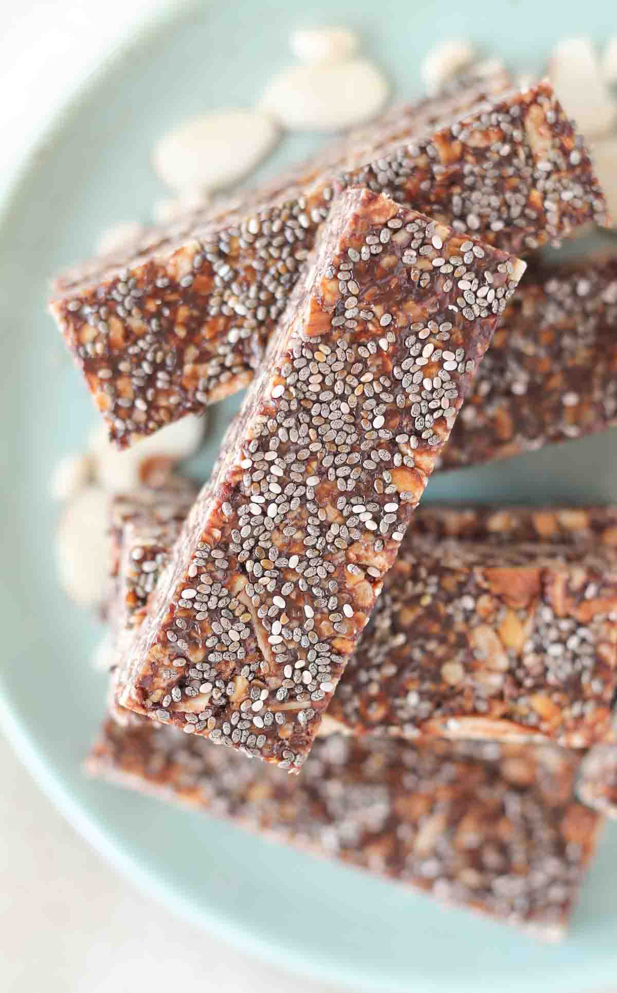 healthy chewy granola bars stacked up on a plate