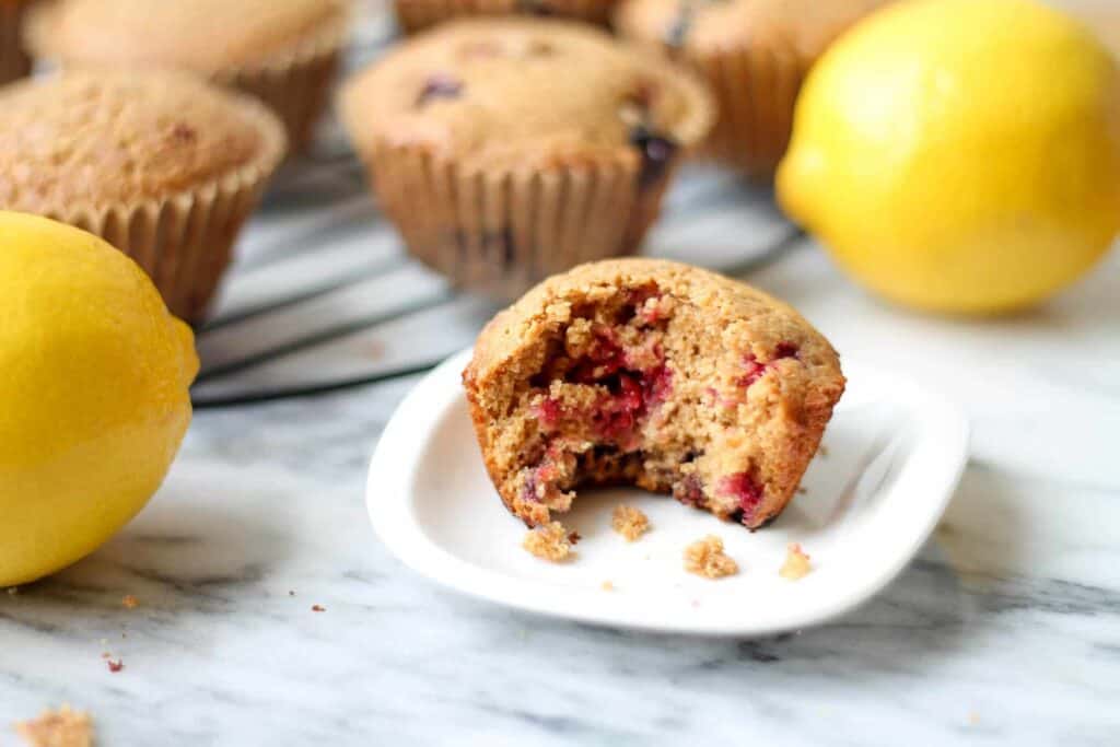 Lemon Berry Spelt Flour Muffins with a bite out of one