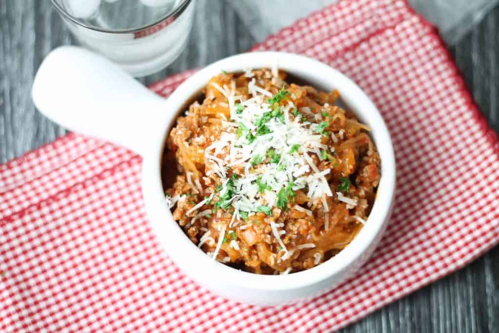 Spaghetti Squash Bolognese on a red checkered napkin