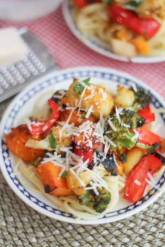 Roasted Vegetable Pasta. Butternut squash, broccoli, carrots and cauliflower get the roasted treatment and are tossed with brown rice pasta and topped with grated Parmesan cheese. #glutenfree #healthy #dinner #recipe