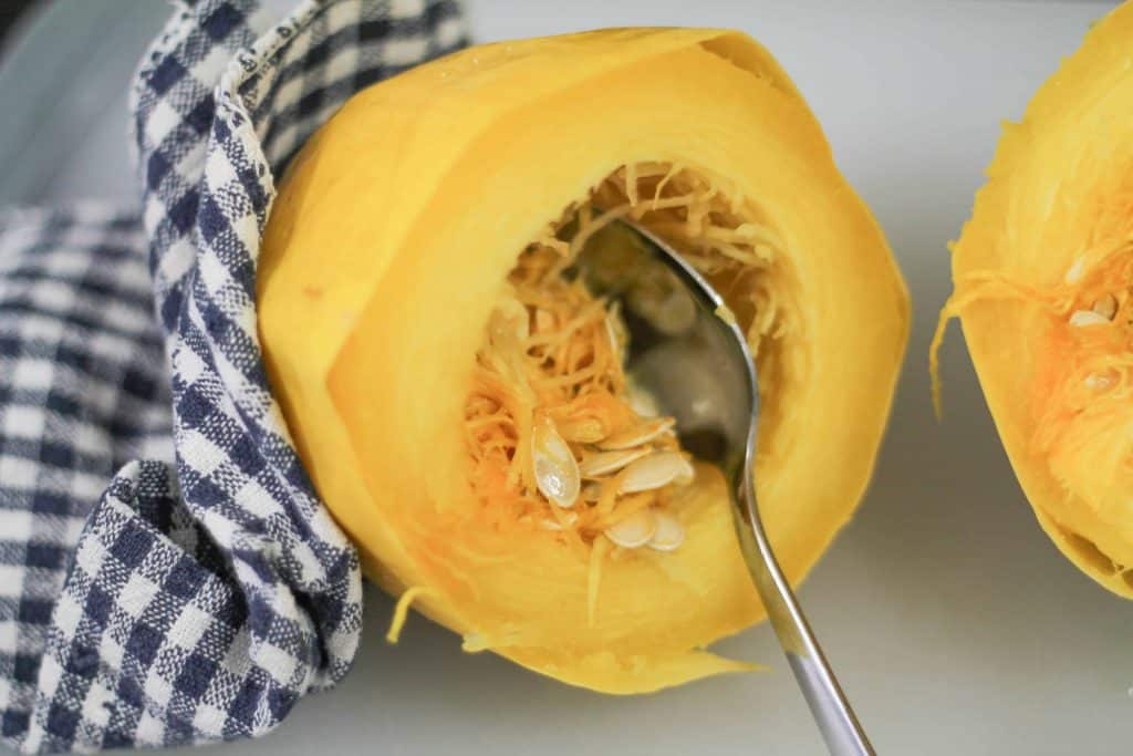 Instant Pot Spaghetti Squash cut in half with the seeds scooped out with a spoon