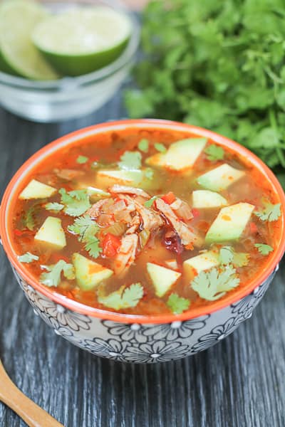 soup bowl topped with fresh avocado