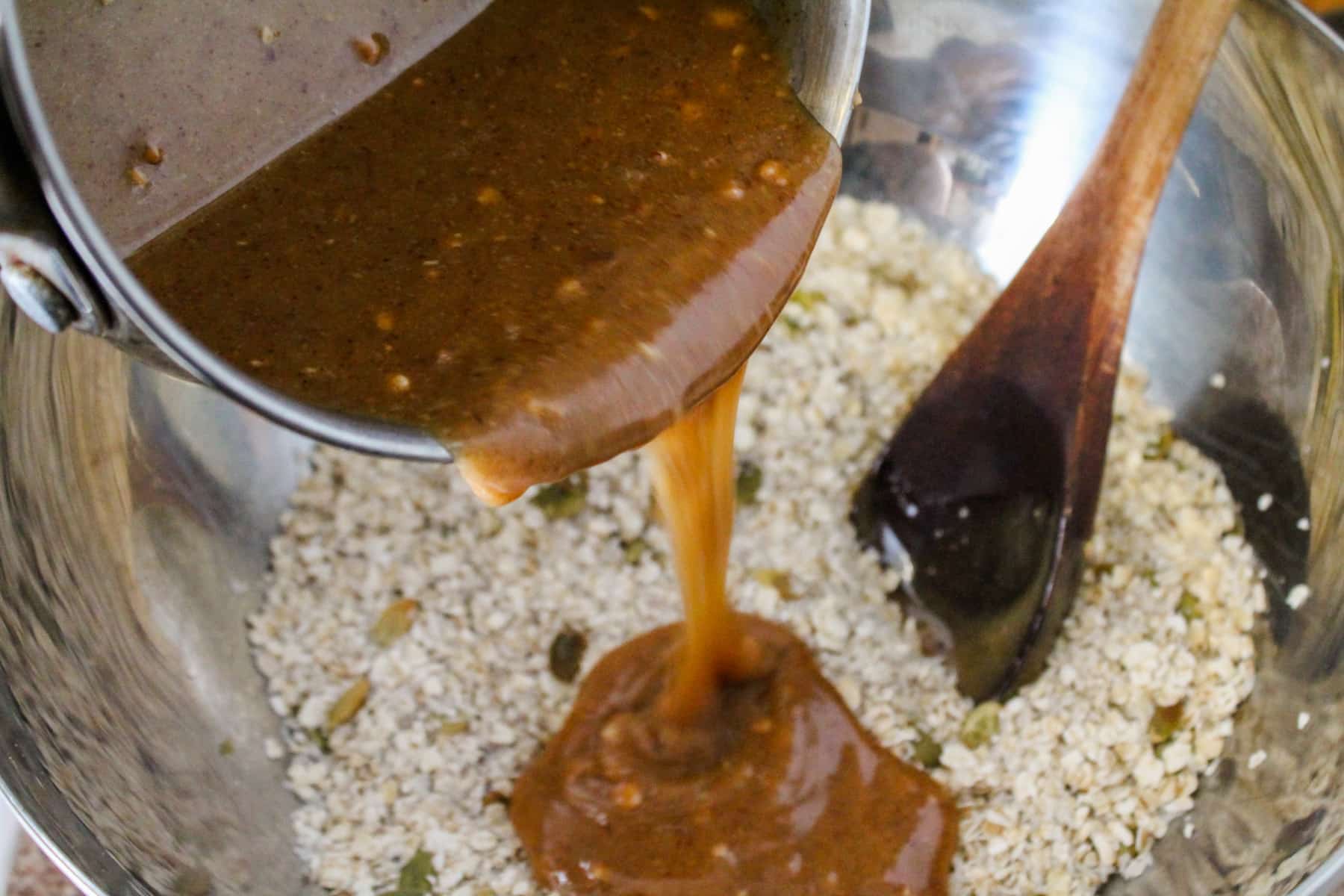 brown rice mixture being poured over dry ingredients.