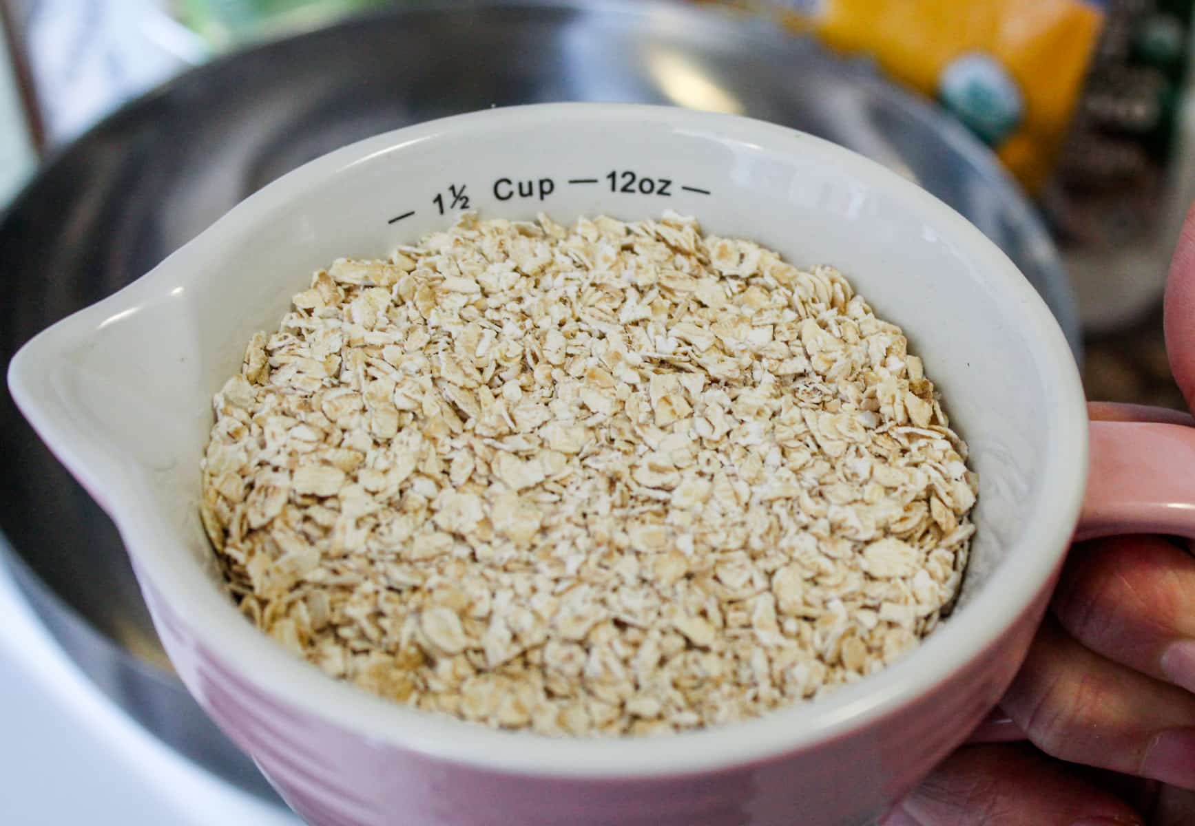 a measuring cup of oats.