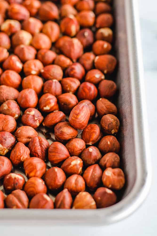 a tray of raw nuts ready for the oven.