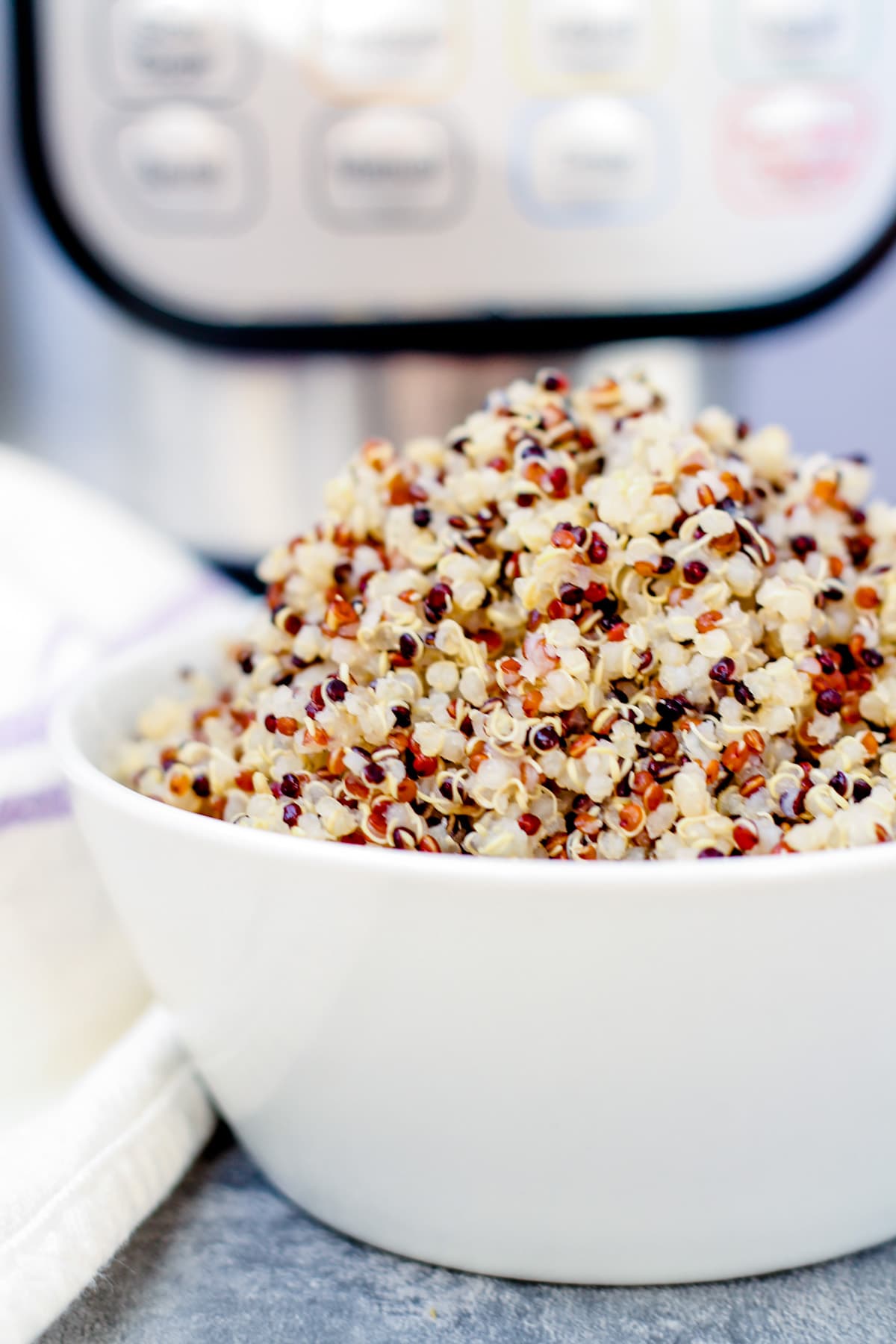 A bowl of Instant Pot Quinoa on a counter.